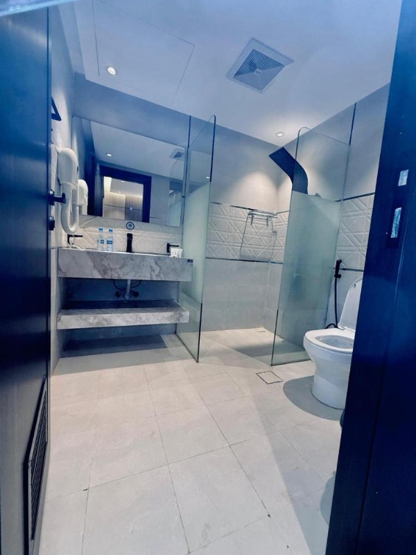 Spacious bathroom with tile and amenities in a 3 star hotel in Riyadh
