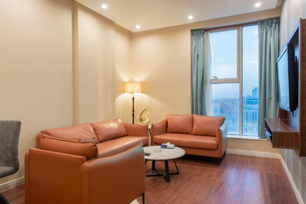 Orange sofa and reading chair at 3 star hotel in Riyadh