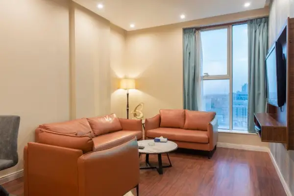 Orange sofa and reading chair at 3 star hotel in Riyadh